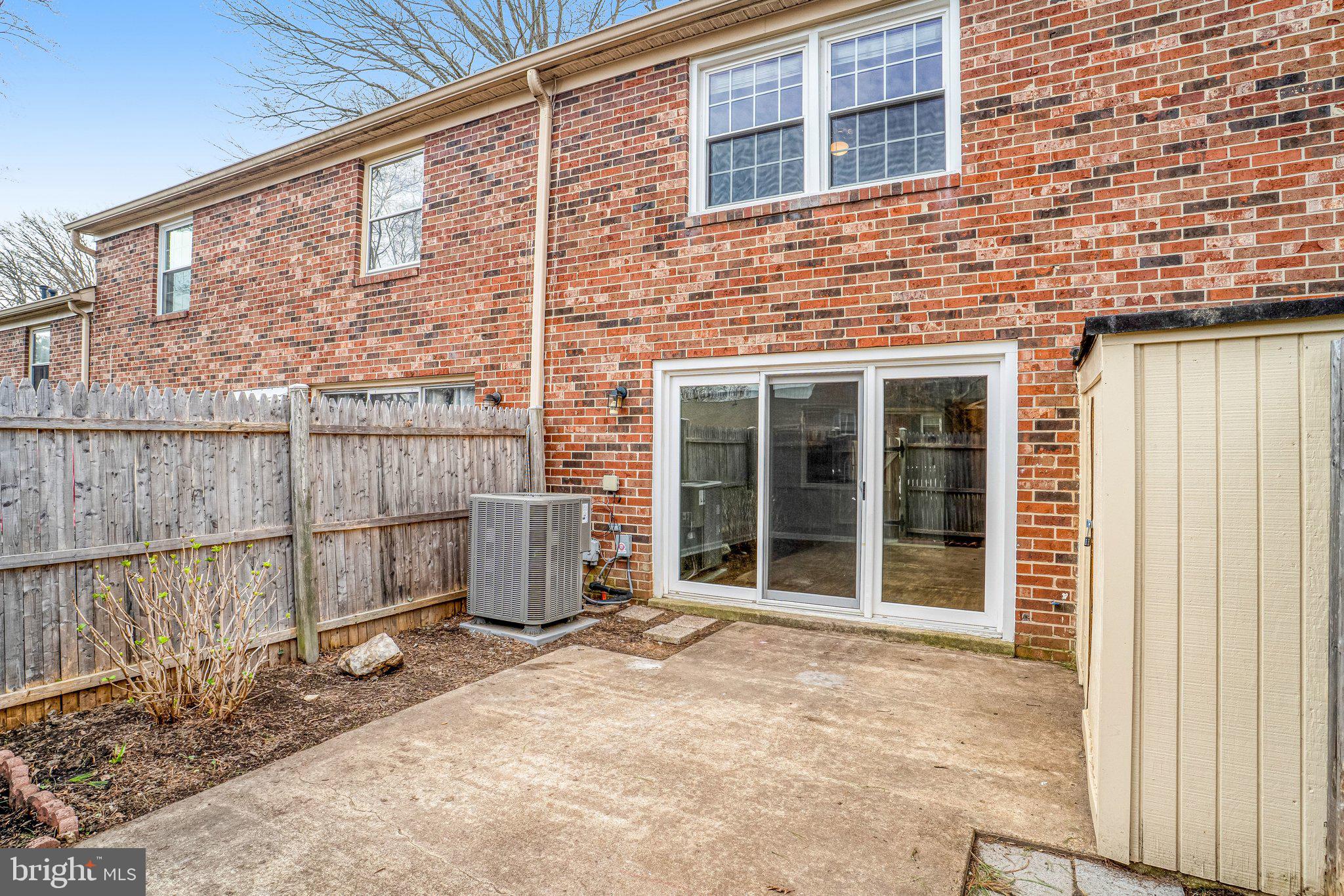 8396 Forrester Boulevard, Unit 555 Springfield, VA 22152 - Photo 22 of 24 a view of a house with a backyard