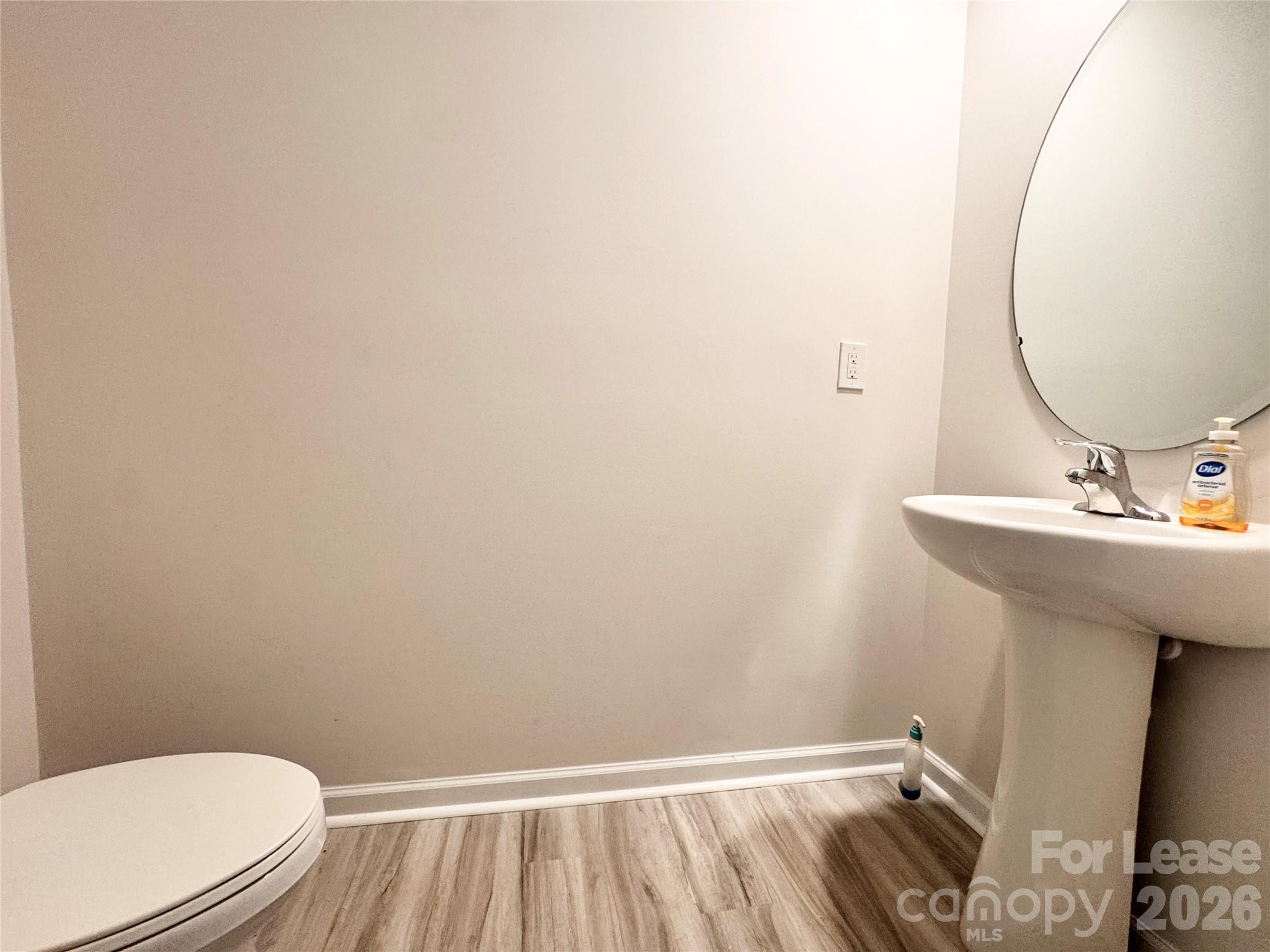 6131 Faron Way Charlotte, NC 28262 - Photo 14 of 18 a bathroom with a sink and a mirror