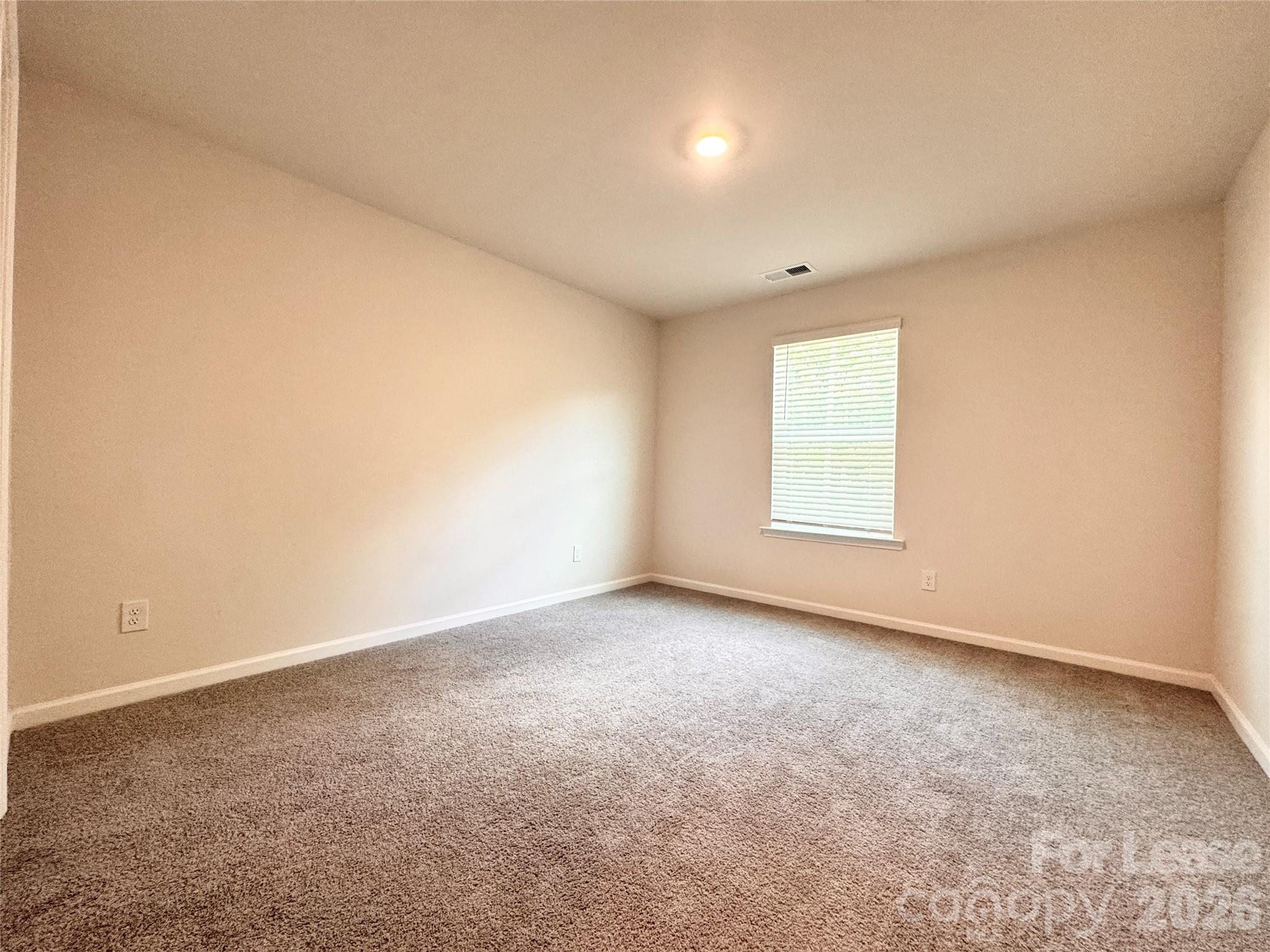 6131 Faron Way Charlotte, NC 28262 - Photo 9 of 18 an empty room with windows
