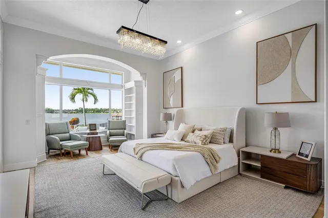 a spacious bedroom with a bed and a couch