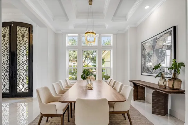a view of a dining room with furniture and window