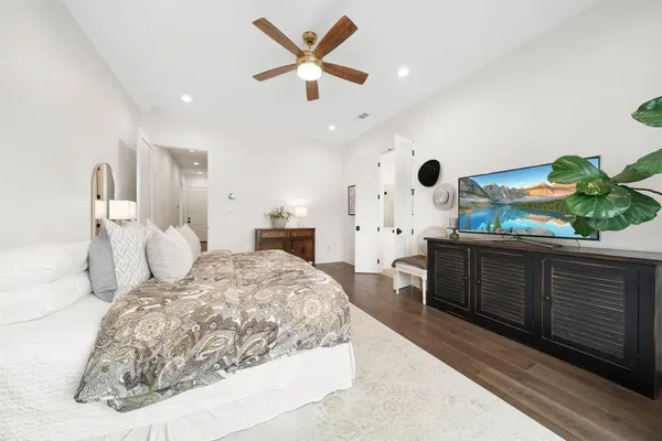 a bedroom with a bed and a dresser