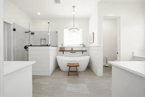 a bathroom with a bathtub and sink