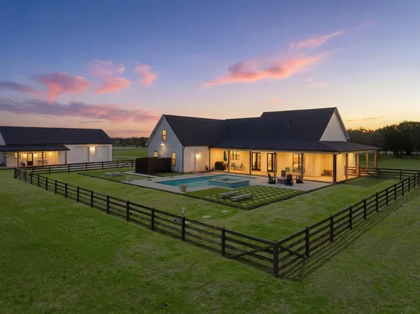 a view of a house with a big yard