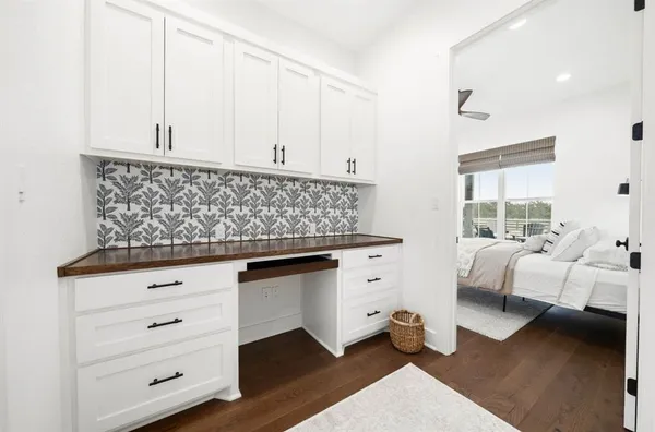 a living room with furniture and a night stand