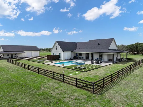 a view of a house with a big yard