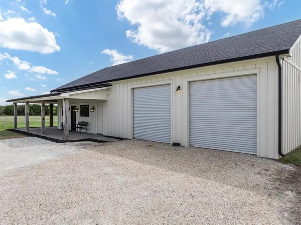 a view of house with garage