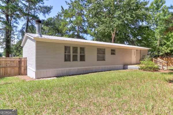 a view of front of house with a yard
