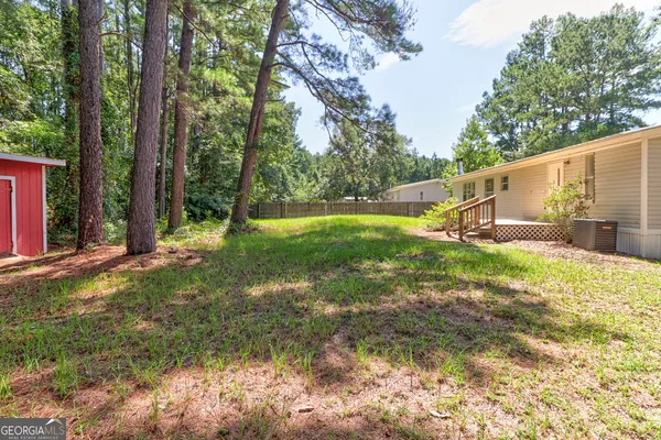 a view of a backyard with tree s