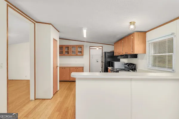 a kitchen with stainless steel appliances a refrigerator and a sink