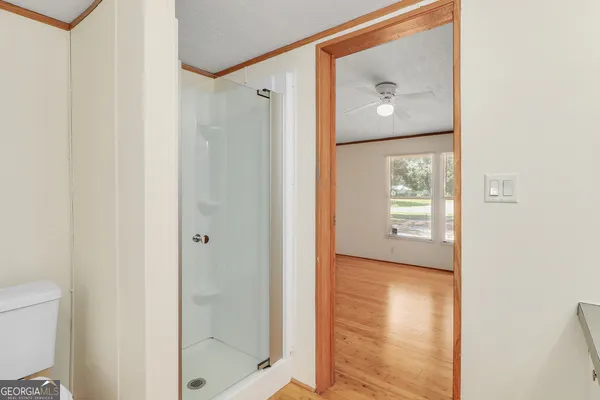 a view of a bathroom from a hallway