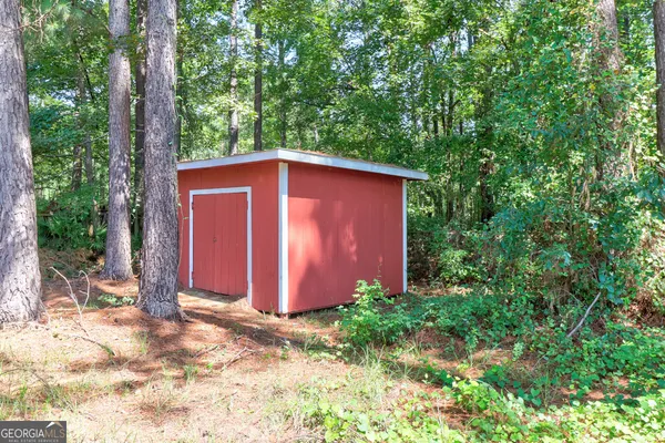 a view of a backyard of the house