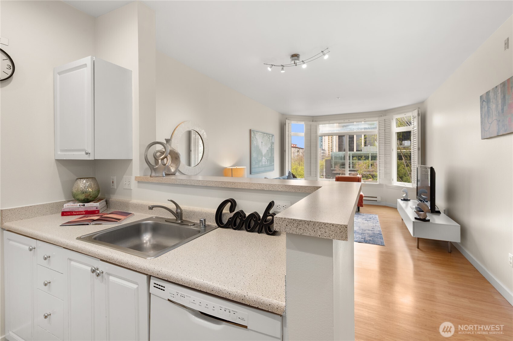 2415 2nd Avenue, Unit 540 Seattle, WA 98121 - Photo 11 of 29 a kitchen with cabinets a sink and appliances