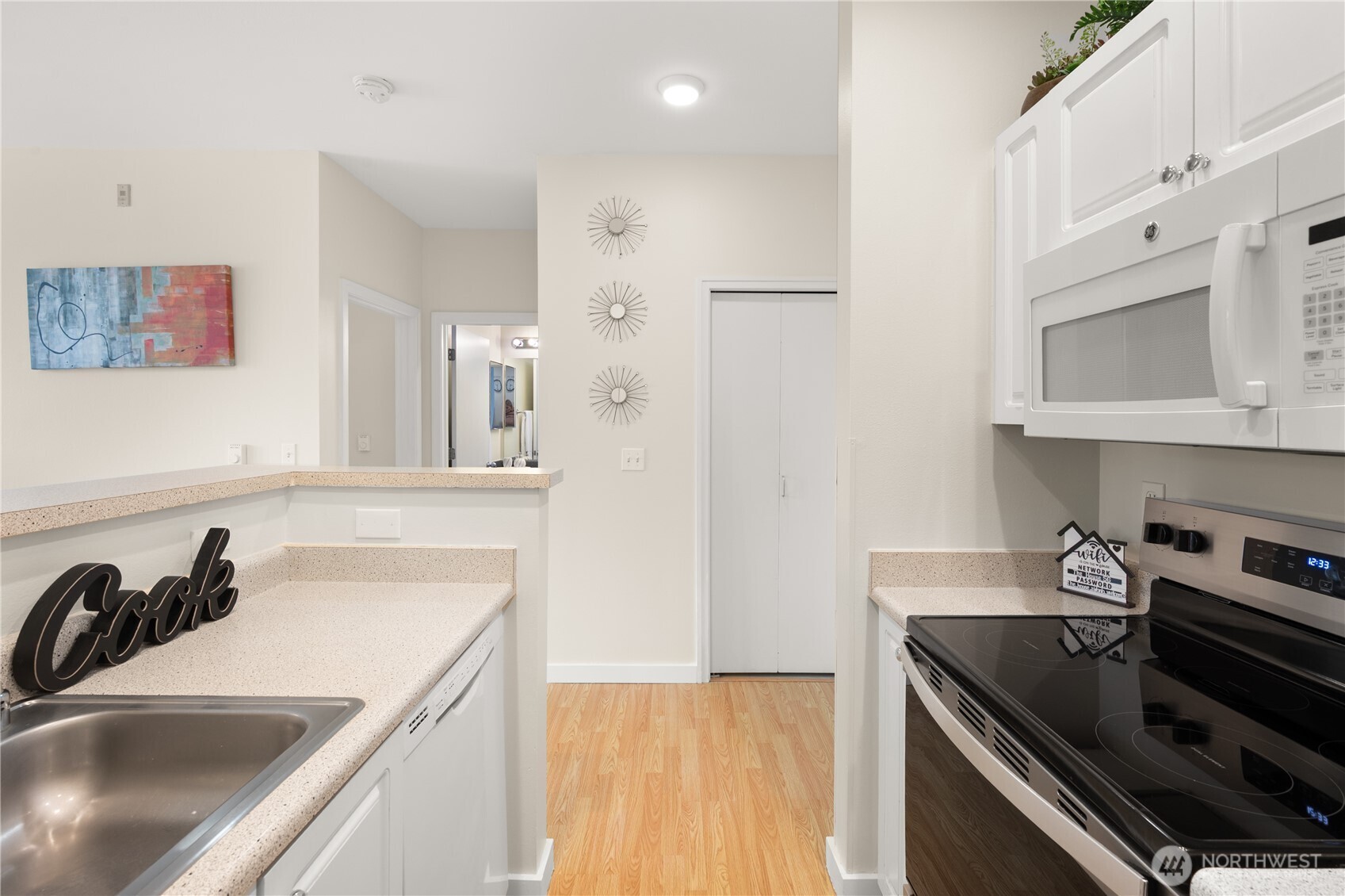 2415 2nd Avenue, Unit 540 Seattle, WA 98121 - Photo 12 of 29 a kitchen that has a sink and a stove