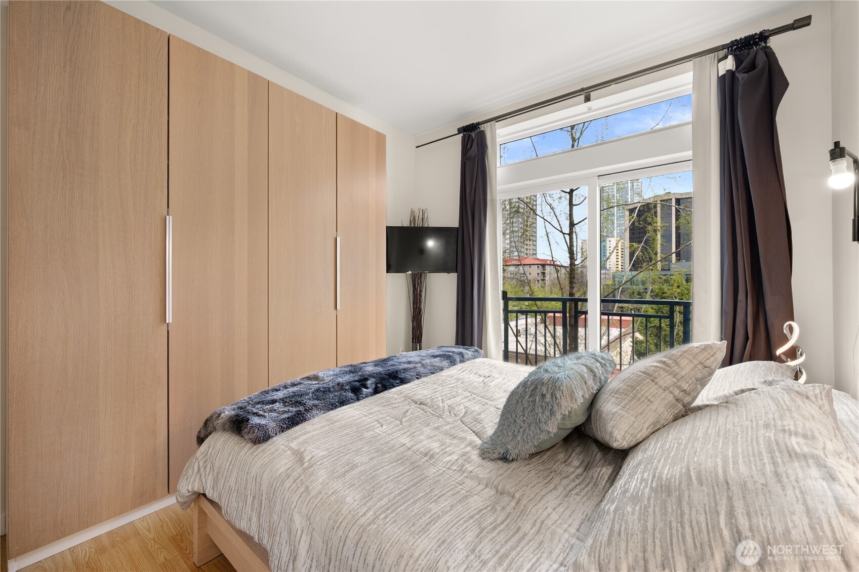 2415 2nd Avenue, Unit 540 Seattle, WA 98121 - Photo 13 of 29 a bedroom with a bed and a window