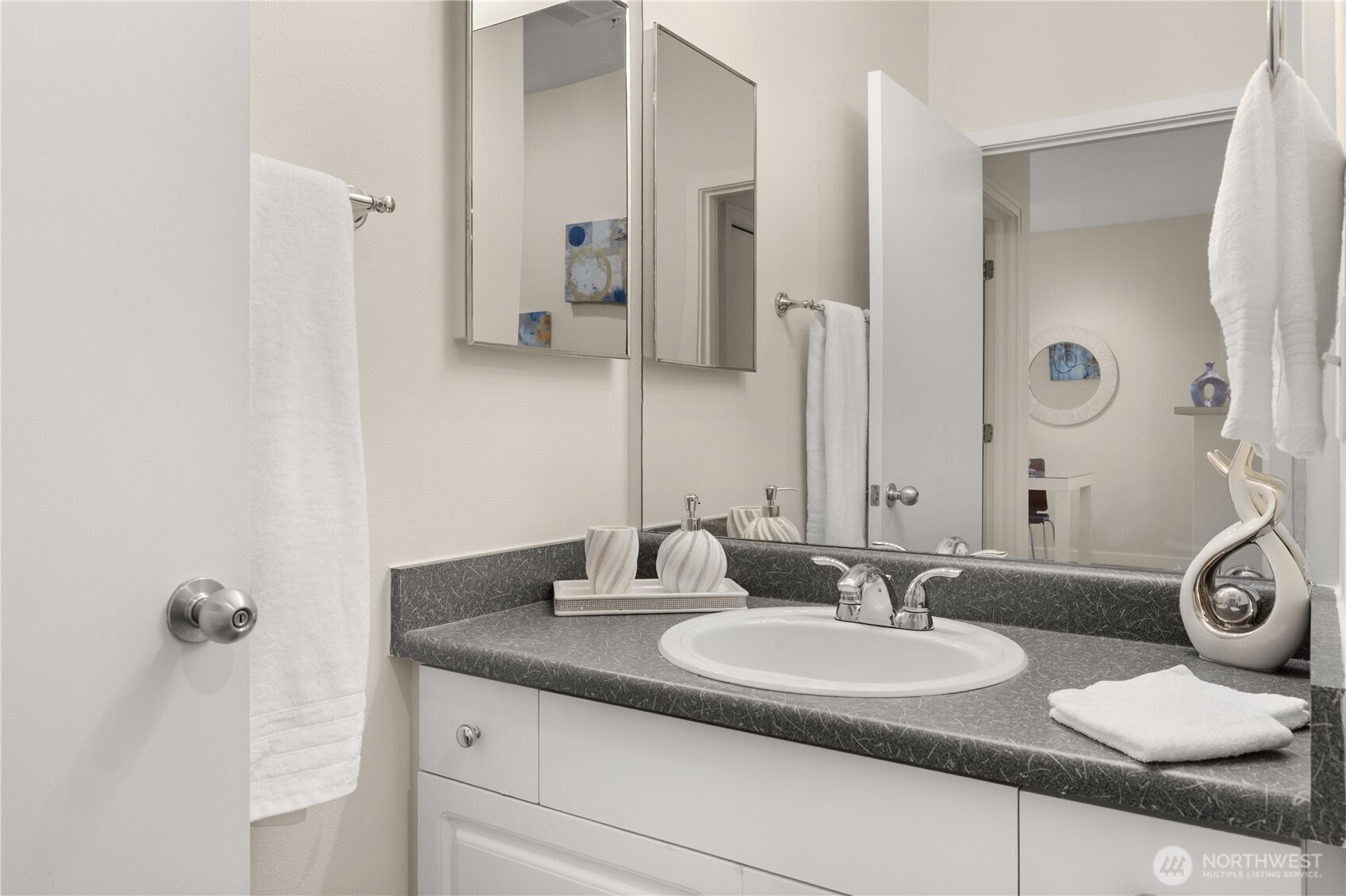 2415 2nd Avenue, Unit 540 Seattle, WA 98121 - Photo 15 of 29 a bathroom with a granite countertop sink and a mirror