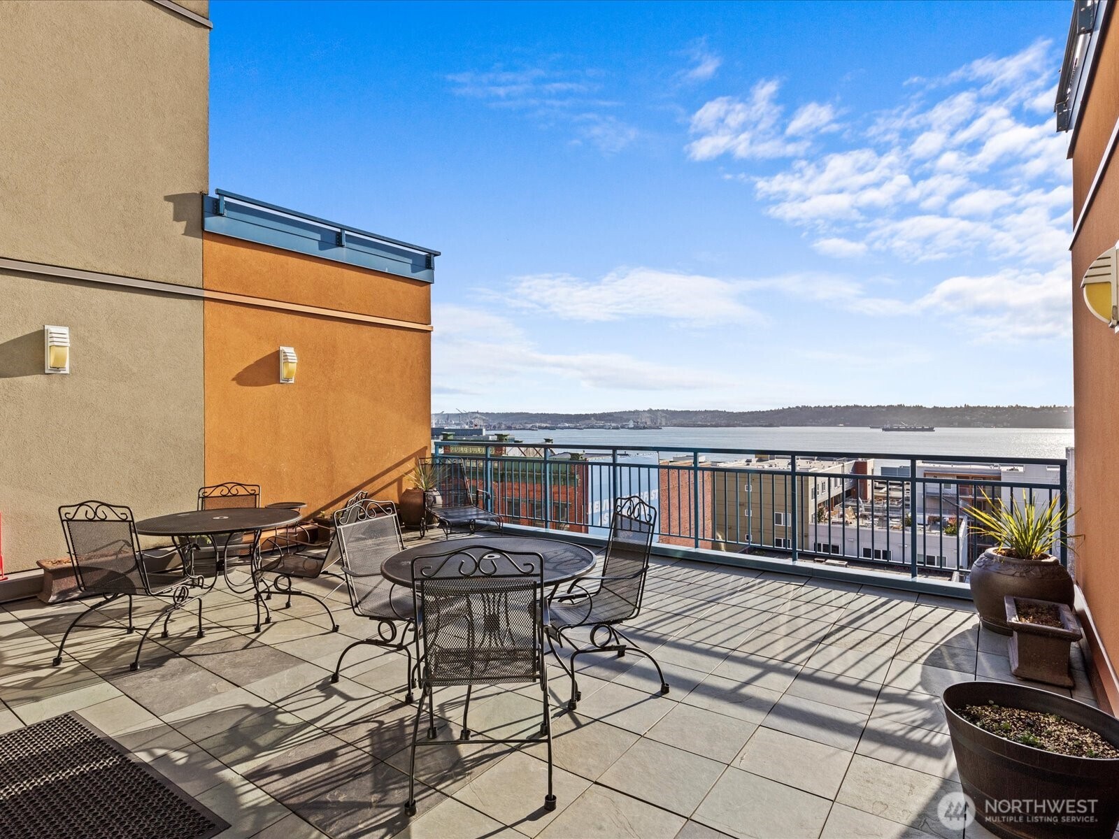 2415 2nd Avenue, Unit 540 Seattle, WA 98121 - Photo 19 of 29 a view of balcony with chairs and wooden floor