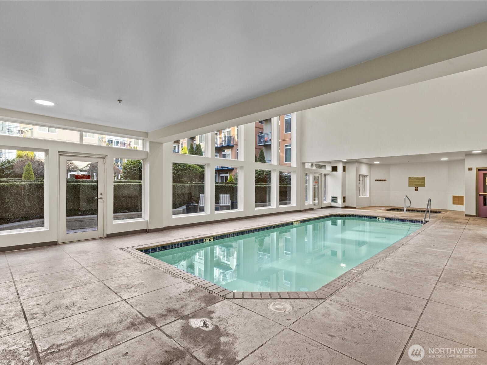 2415 2nd Avenue, Unit 540 Seattle, WA 98121 - Photo 20 of 29 a view of a swimming pool with a lounge chairs