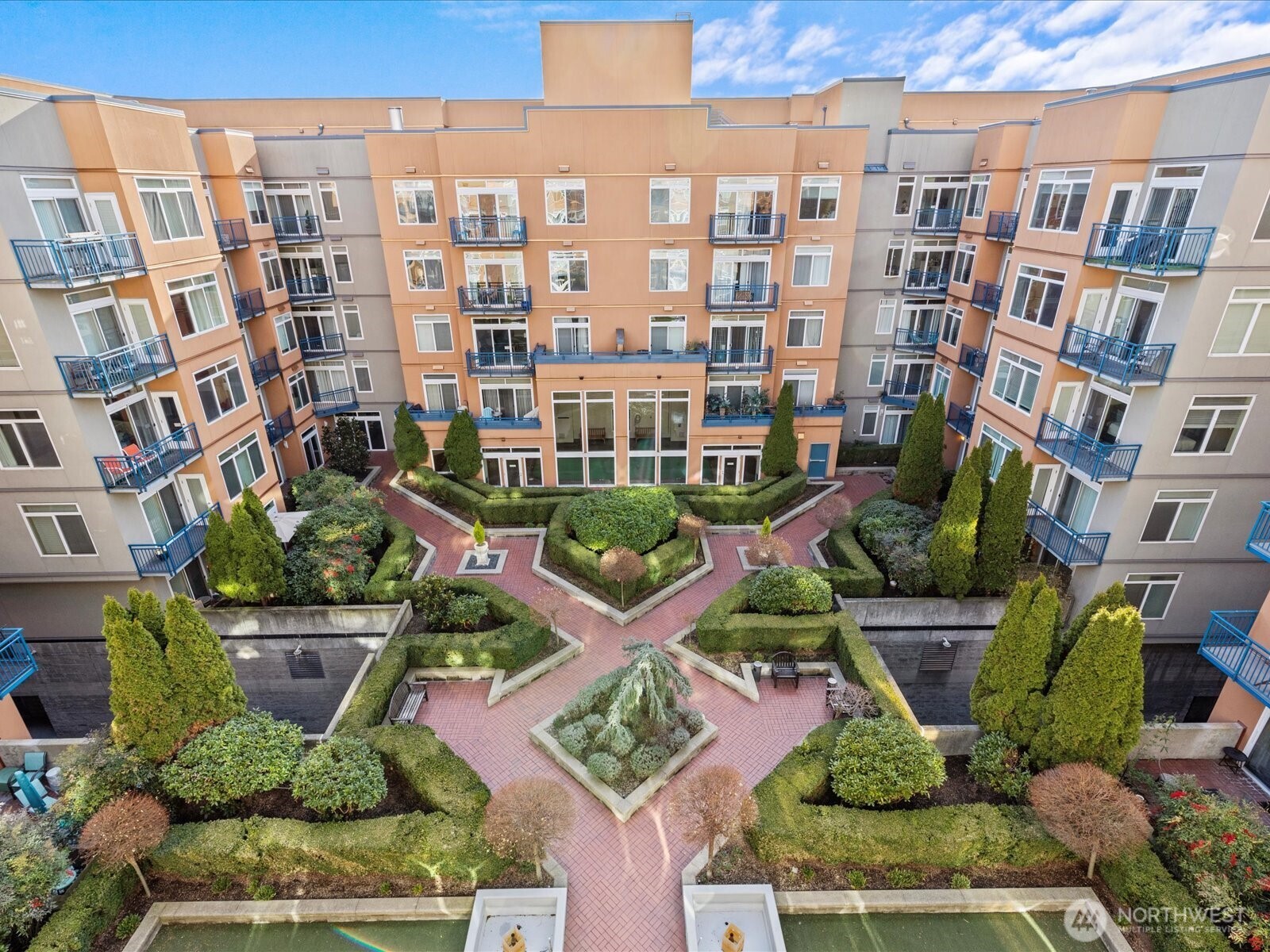 2415 2nd Avenue, Unit 540 Seattle, WA 98121 - Photo 23 of 29 a view of a building with a garden and plants