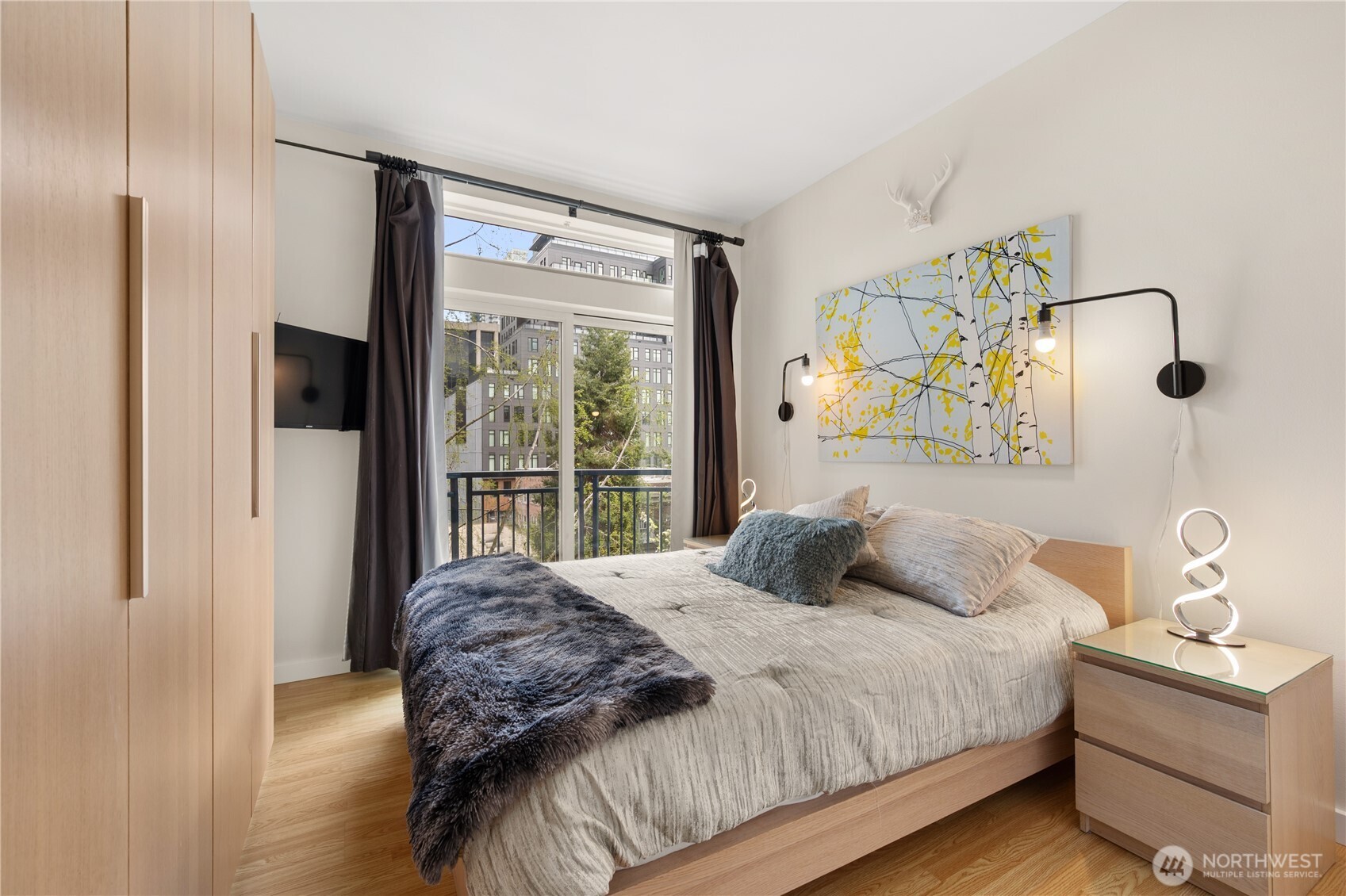 2415 2nd Avenue, Unit 540 Seattle, WA 98121 - Photo 4 of 29 a bedroom with a bed and a window