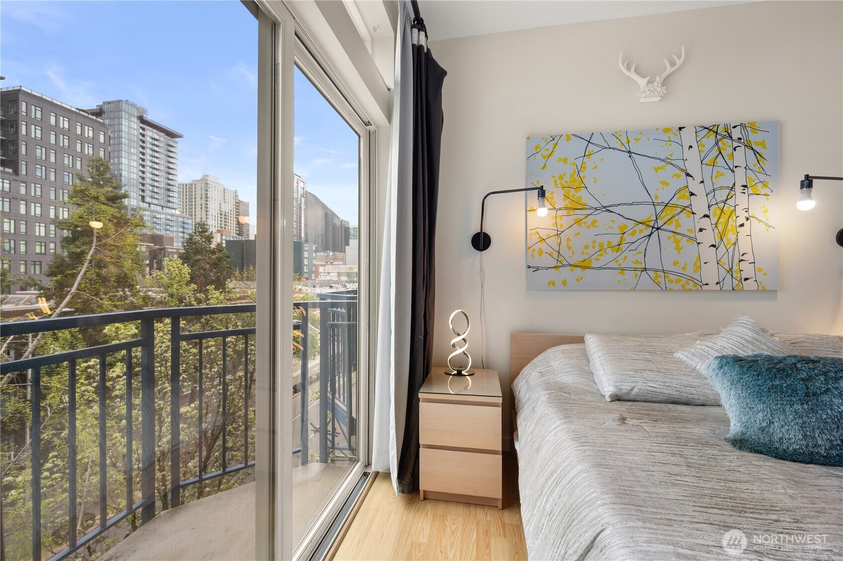 2415 2nd Avenue, Unit 540 Seattle, WA 98121 - Photo 5 of 29 a balcony view with a couch and table