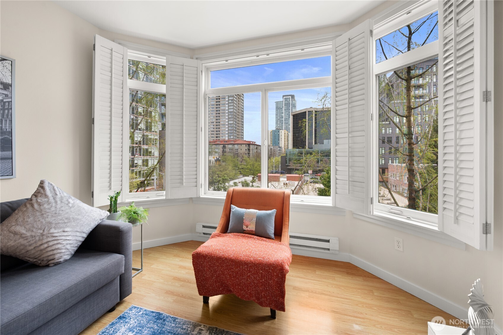 2415 2nd Avenue, Unit 540 Seattle, WA 98121 - Photo 8 of 29 a living room with furniture and a window