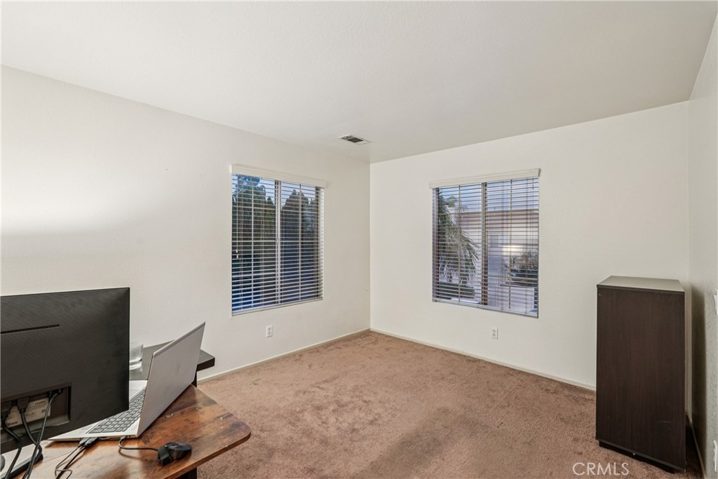 988 Cimarron Place Corona, CA 92879 - Photo 14 of 23 a view of an empty room with a window