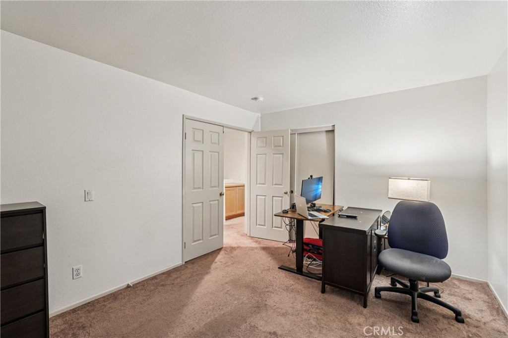 988 Cimarron Place Corona, CA 92879 - Photo 15 of 23 a view of a workspace with furniture and a window