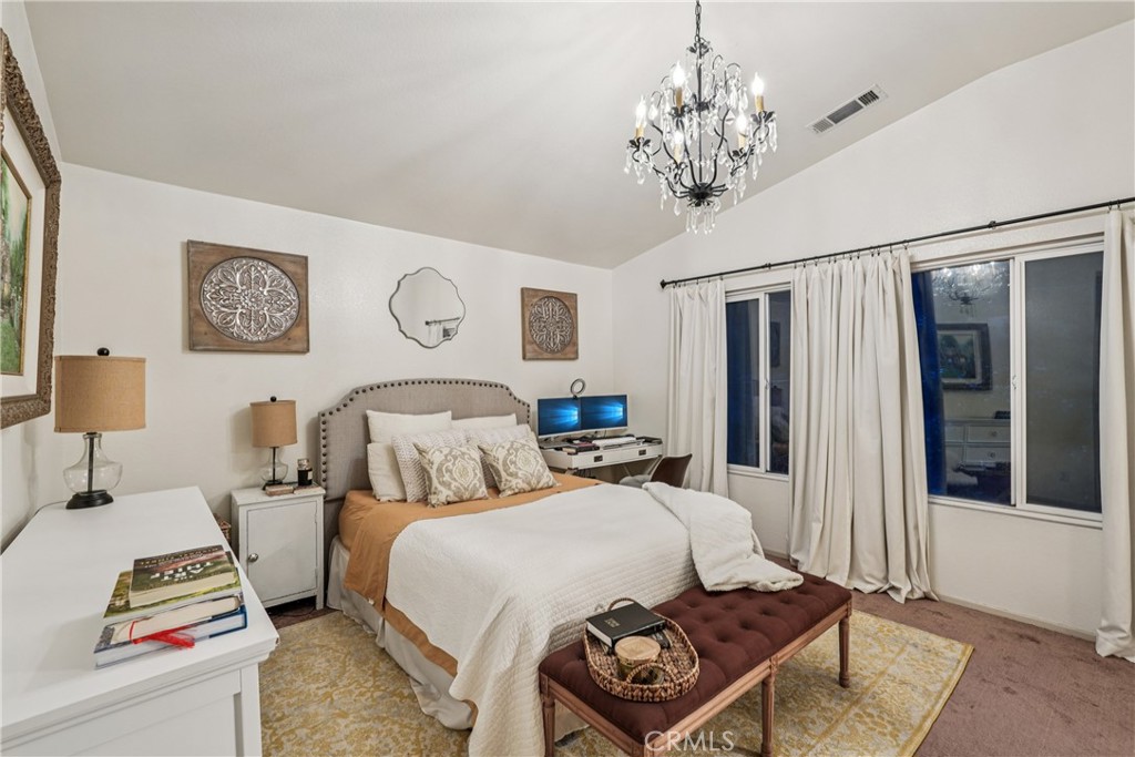 988 Cimarron Place Corona, CA 92879 - Photo 18 of 23 a bedroom with two beds and a chandelier