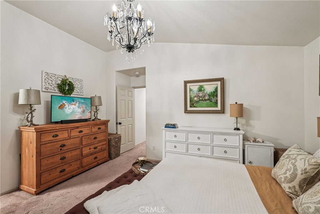 988 Cimarron Place Corona, CA 92879 - Photo 19 of 23 a bed room with a bed and a television