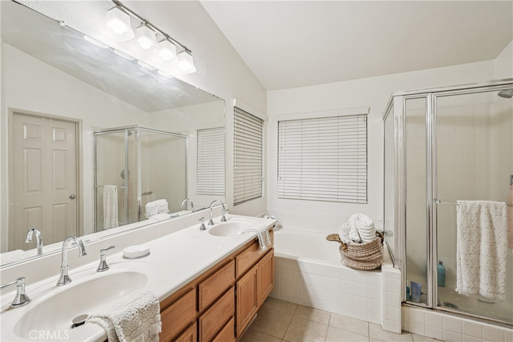988 Cimarron Place Corona, CA 92879 - Photo 20 of 23 a spacious bathroom with sinks mirror and a shower