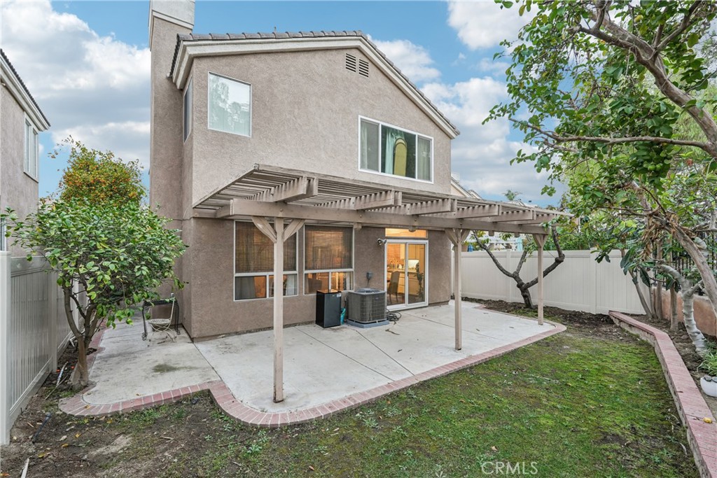 988 Cimarron Place Corona, CA 92879 - Photo 21 of 23 a front view of a house with a garden