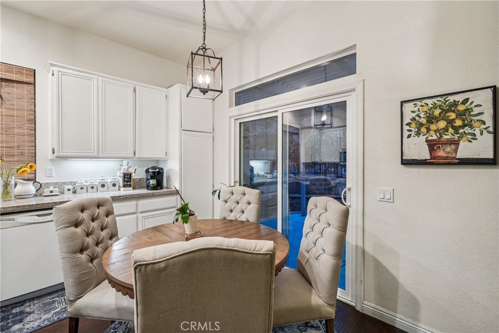 988 Cimarron Place Corona, CA 92879 - Photo 7 of 23 a living room with furniture and a chandelier