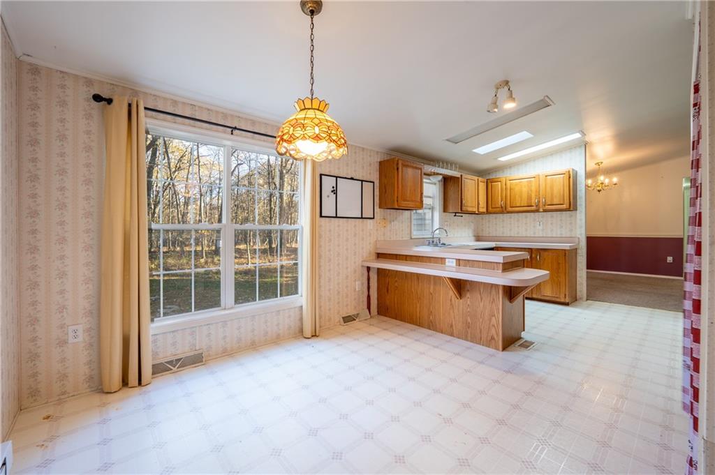 402 Ridgeview Road Boswell, PA 15531 - Photo 13 of 32 a view of a kitchen with a sink and a refrigerator