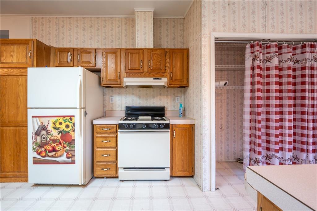 402 Ridgeview Road Boswell, PA 15531 - Photo 14 of 32 a kitchen with a refrigerator and a stove top oven
