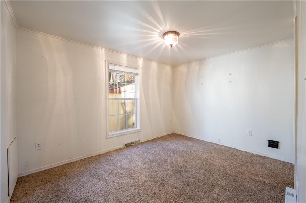 402 Ridgeview Road Boswell, PA 15531 - Photo 18 of 32 an empty room with chandelier fan and windows