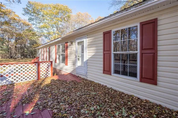 a front view of a house with a large window