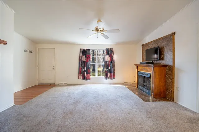 a view of a bathroom with tub walk in closet