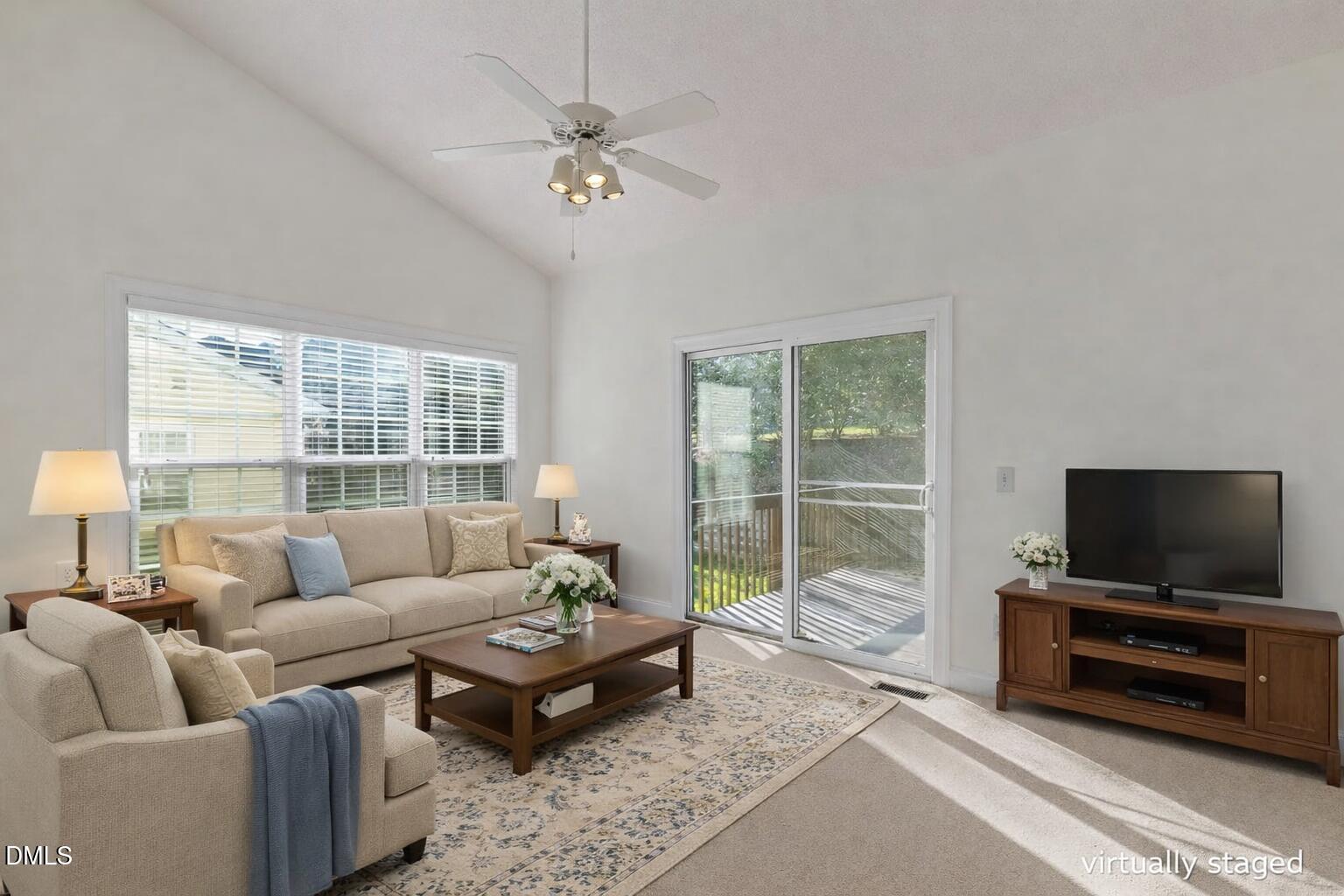 105 Rockport Ridge Way Cary, NC 27519 - Photo 20 of 43 a living room with furniture and a flat screen tv