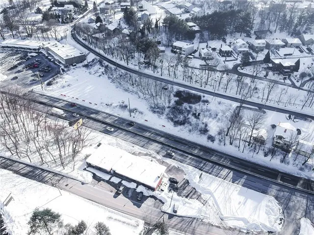 a aerial view of a house with a yard