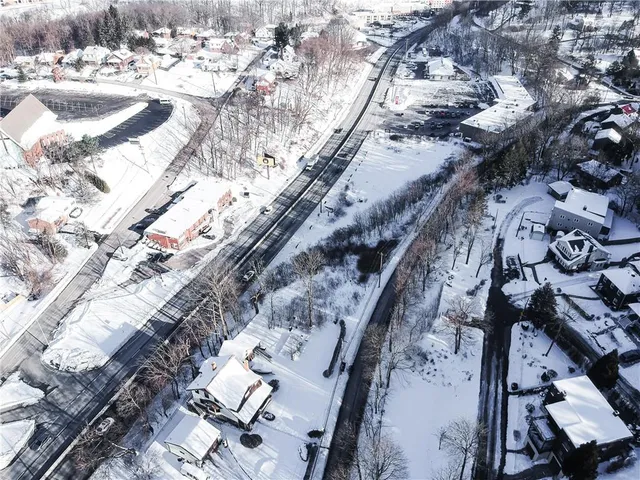 a city view of water with a building in the background