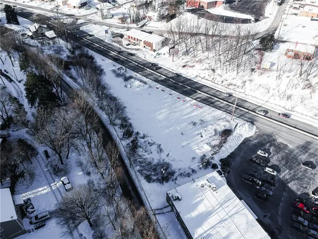 a view of yard with swimming pool and trees