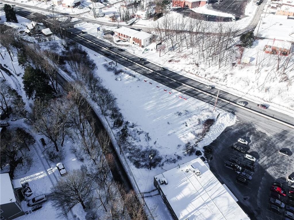 113 Nelson Run Road Pittsburgh, PA 15237 - Photo 9 of 12 a city view of water with a building in the background