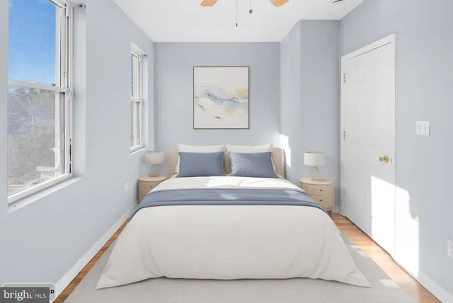 a bedroom with a bed and window