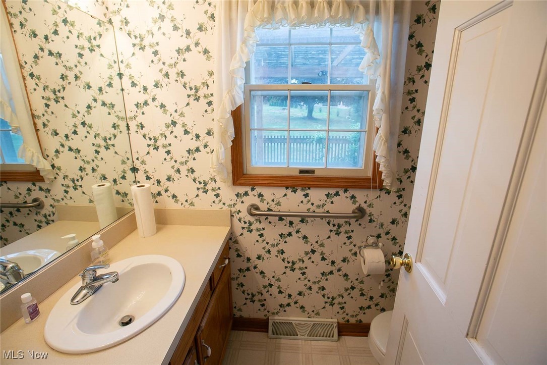 9046 River Styx Road Wadsworth, OH 44281 - Photo 24 of 30 Bathroom featuring tile patterned floors, toilet, and vanity