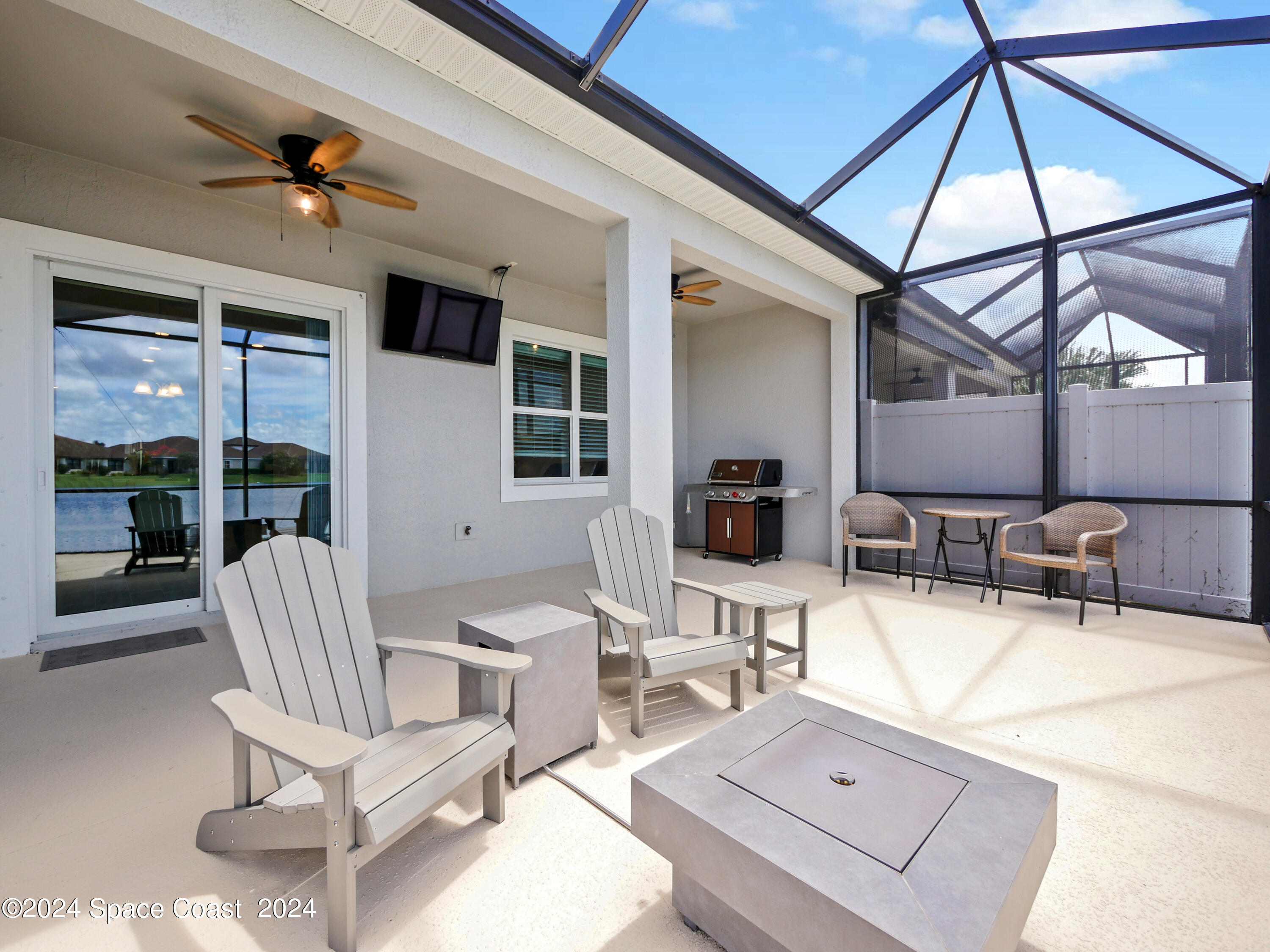 3149 Avalonia Drive Melbourne, FL 32940 - Photo 29 of 31 a building outdoor space with patio furniture and potted plants