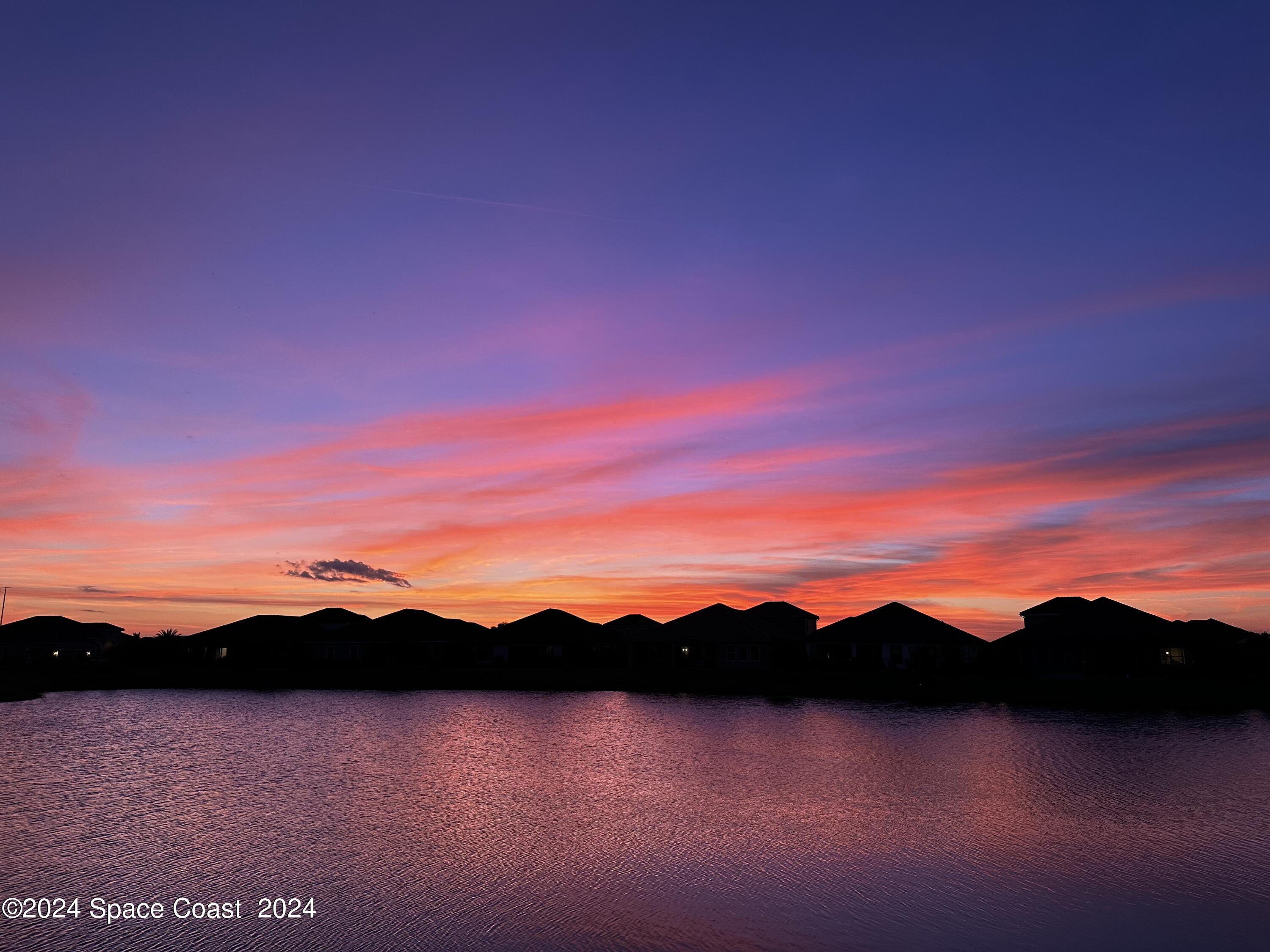 3149 Avalonia Drive Melbourne, FL 32940 - Photo 31 of 31 a view of mountain with sunset in background