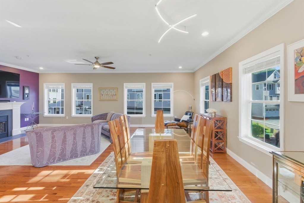 66 Compass Point, Unit 66 North Andover, MA 01845 - Photo 19 of 42 a view of a dining room with furniture wooden floor and a rug