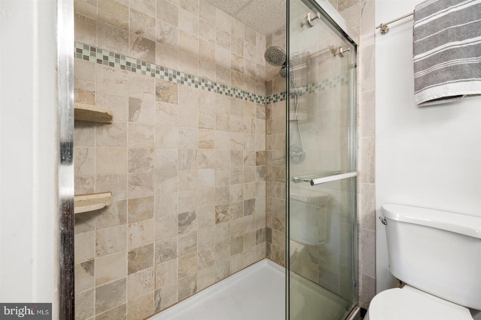 714 Mooring Road, Unit C105 Ocean City, MD 21842 - Photo 25 of 36 Primary bathroom custom tiled shower
