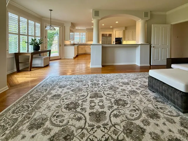 a kitchen with stainless steel appliances kitchen island granite countertop a sink and cabinets
